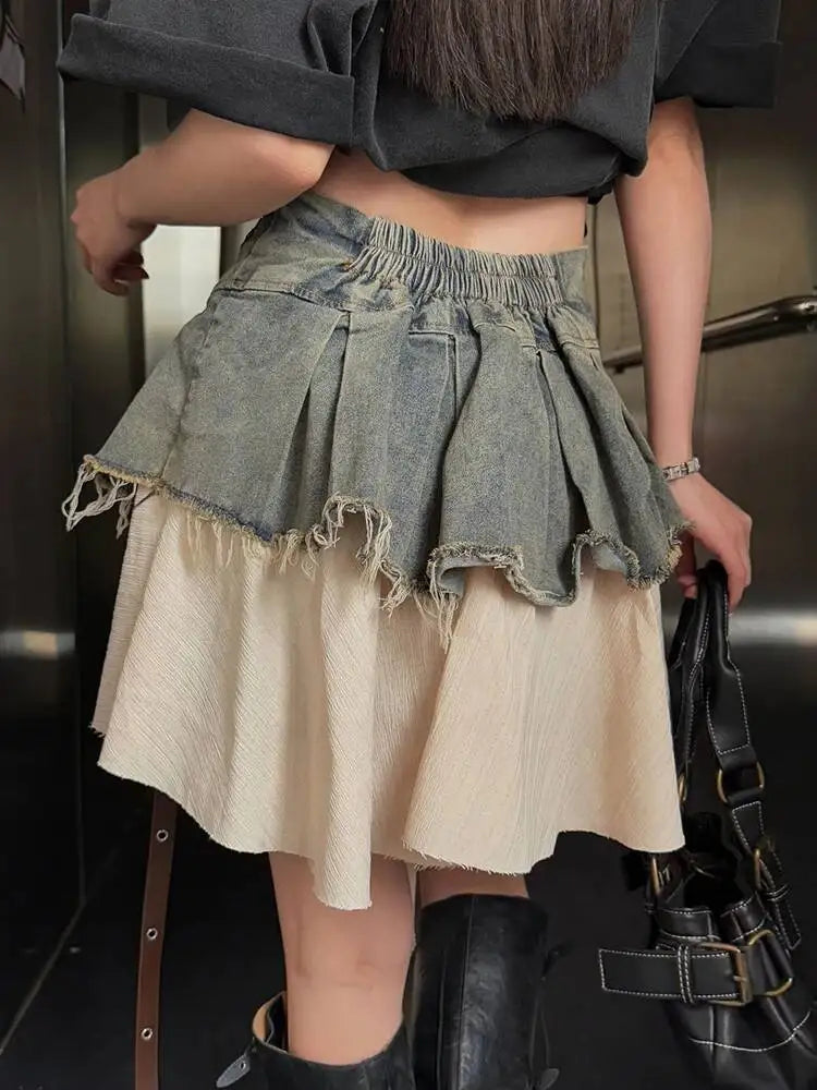 EAM Color-block Irregular Spliced High Elastic Waist A-line Mini Denim Skirt Women Fashion Tide New Spring Autumn 2026 30A3307