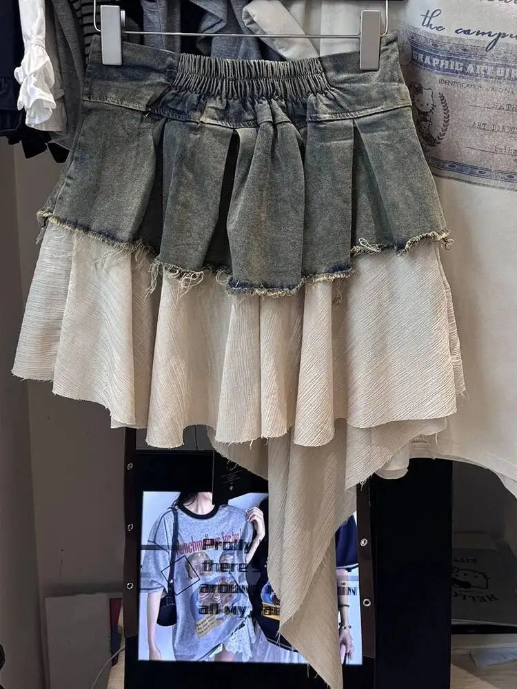 EAM Color-block Irregular Spliced High Elastic Waist A-line Mini Denim Skirt Women Fashion Tide New Spring Autumn 2026 30A3307